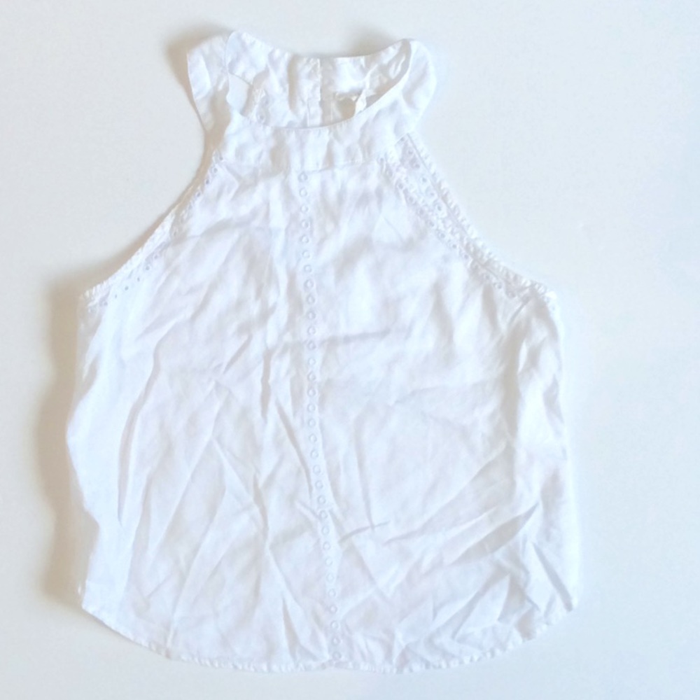 Sleeveless white embroidered cotton top
